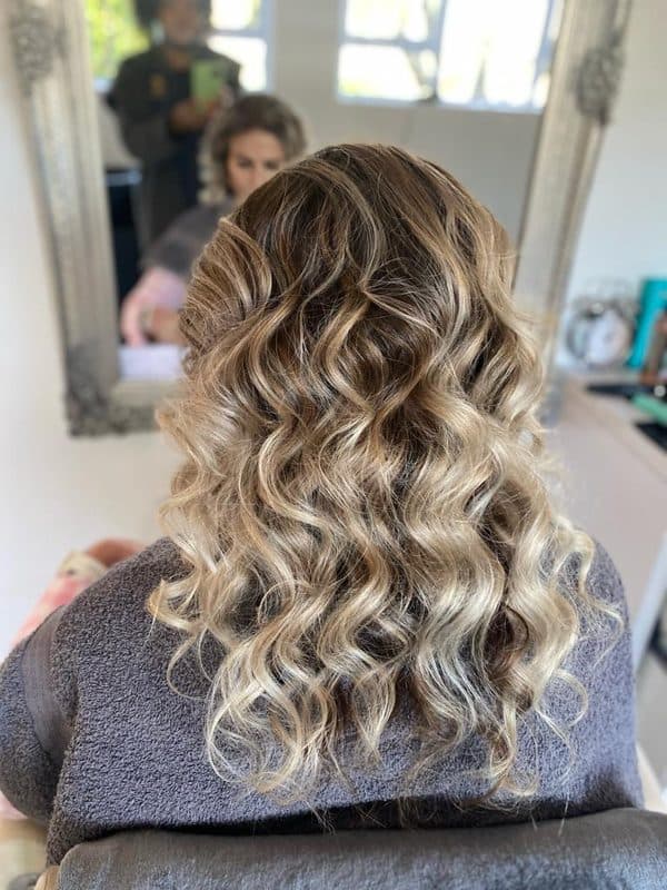 Soft blonde curls styled by Brut Rose
