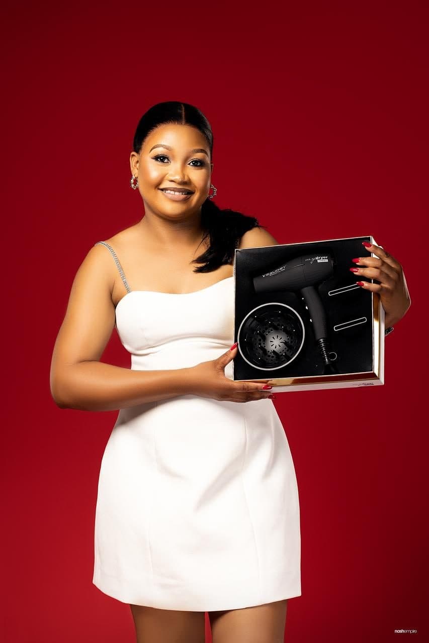 Pam holding a professional hair dryer gift box